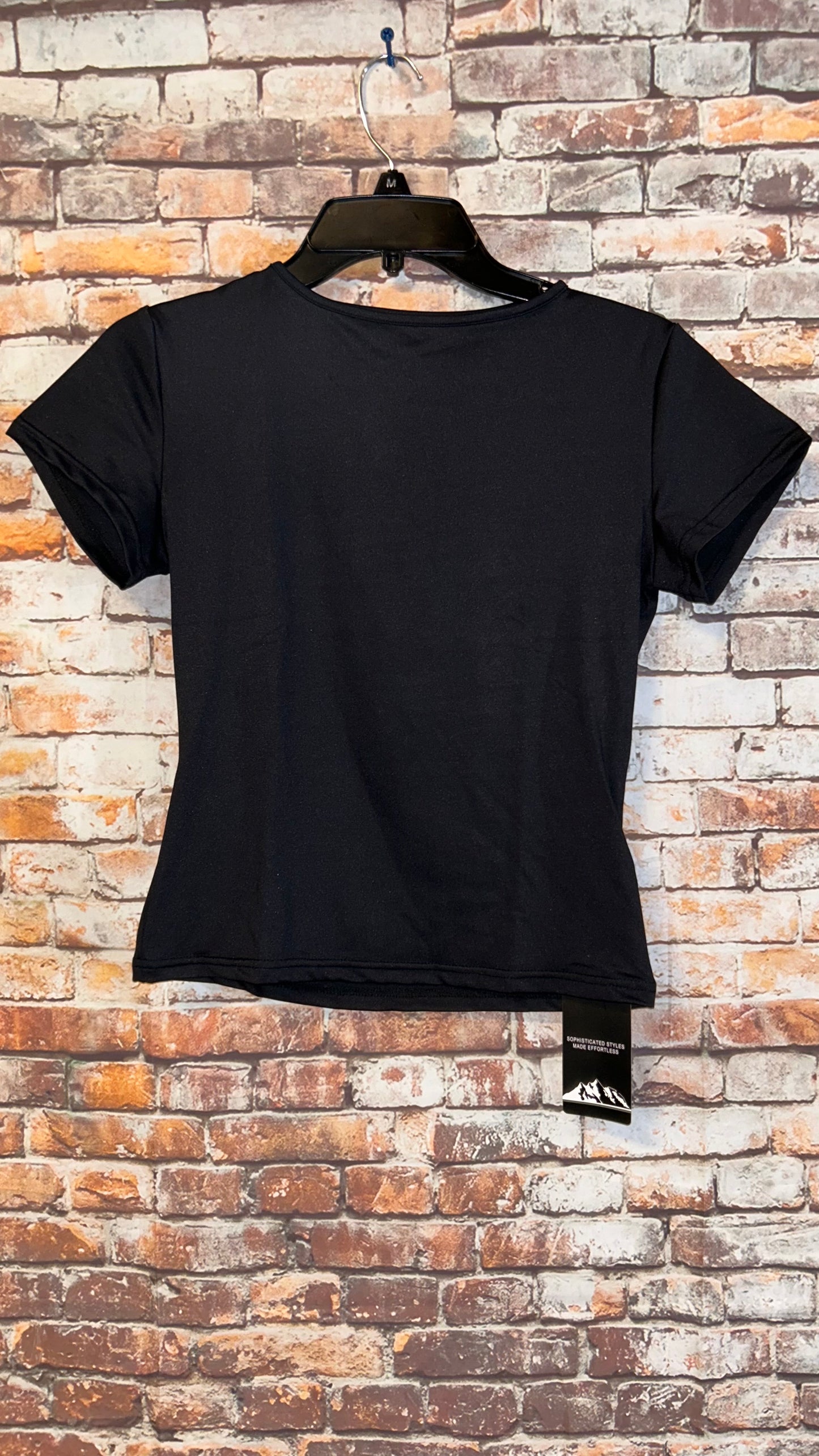 Women’s top size medium fitted with stretch fits like a small