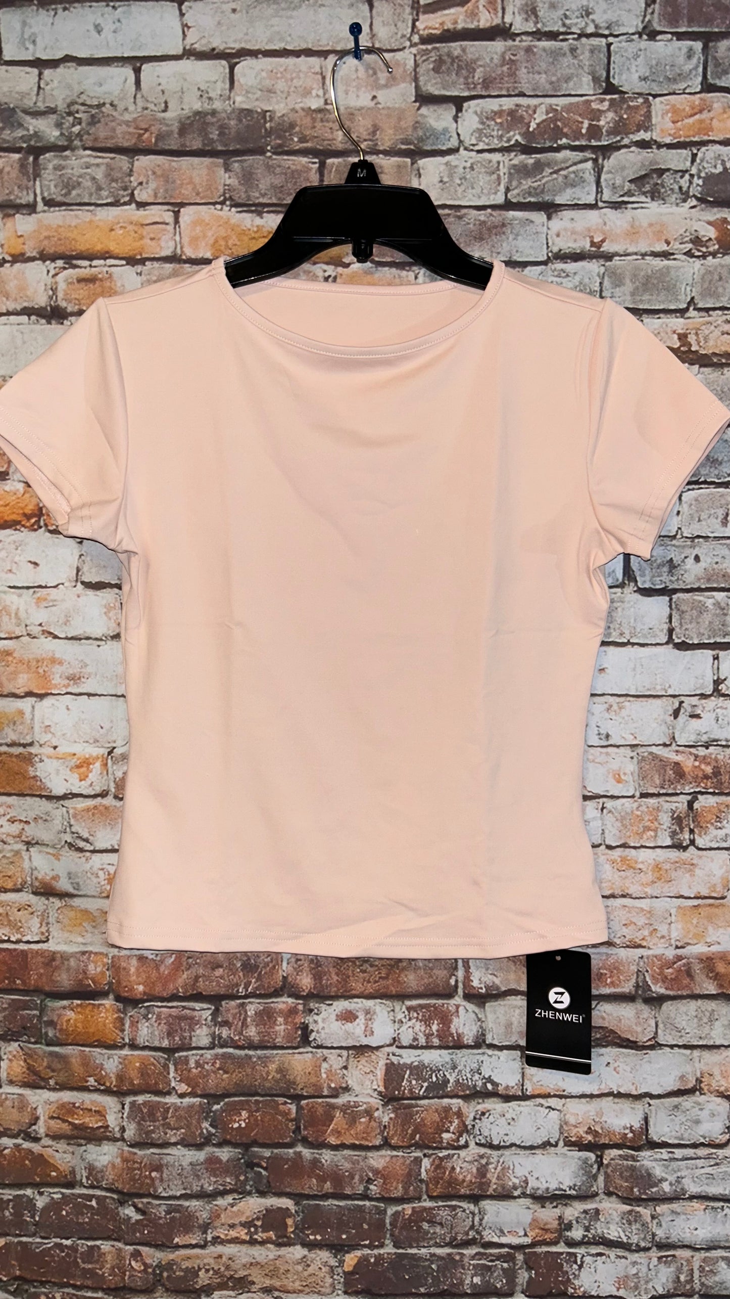 Women’s top size medium fitted with stretch fits like a small