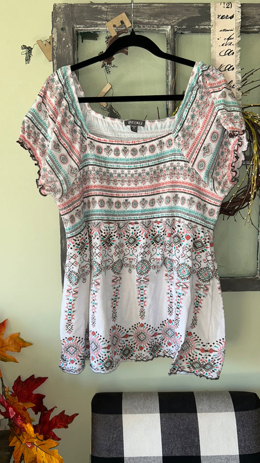 Women’s top size 2x will fit like a 1x with stretch