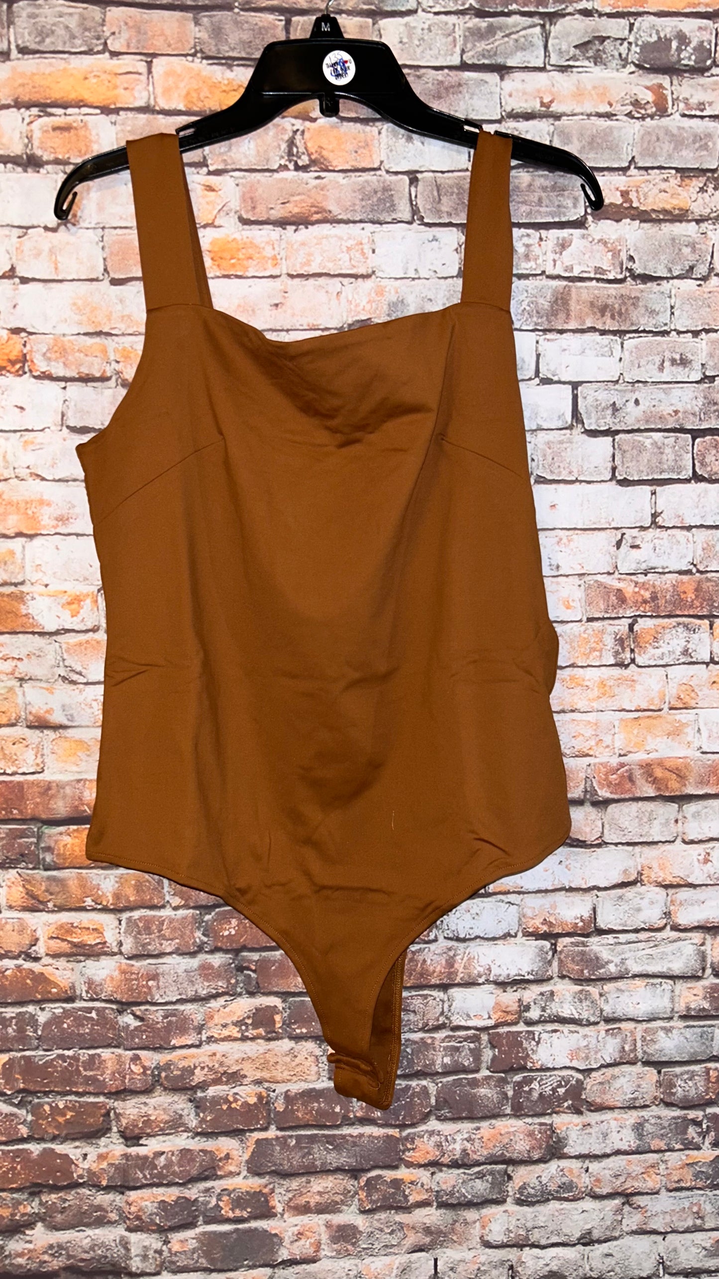 Women’s size 2x bodysuit fits smaller like a fitted 14-16 with stretch